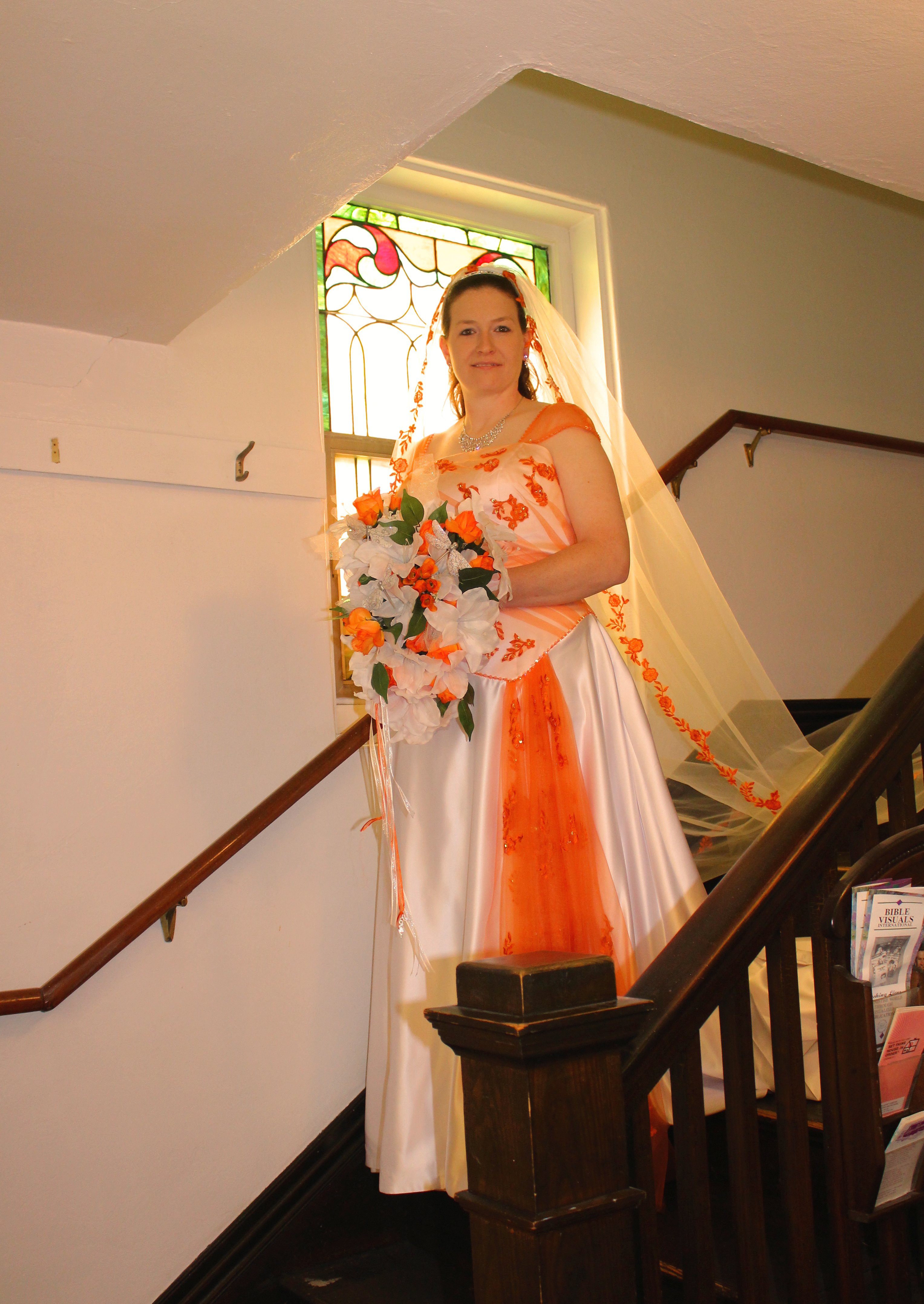 white and orange wedding dress and veil