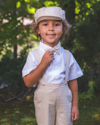 Ring bearer, suspender outfit for hot summer weddings. Includes shorts with matching suspenders and bow tie, and a white short-sleeve shirt