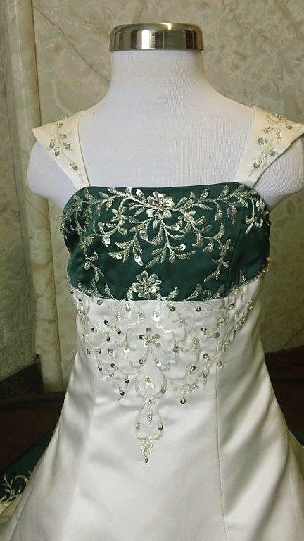 wedding dress with emerald green accents
