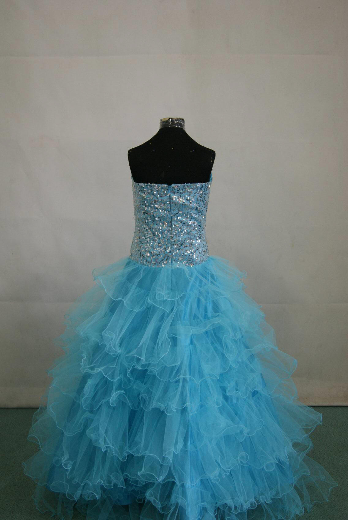 long strapless pool blue layered prom gown