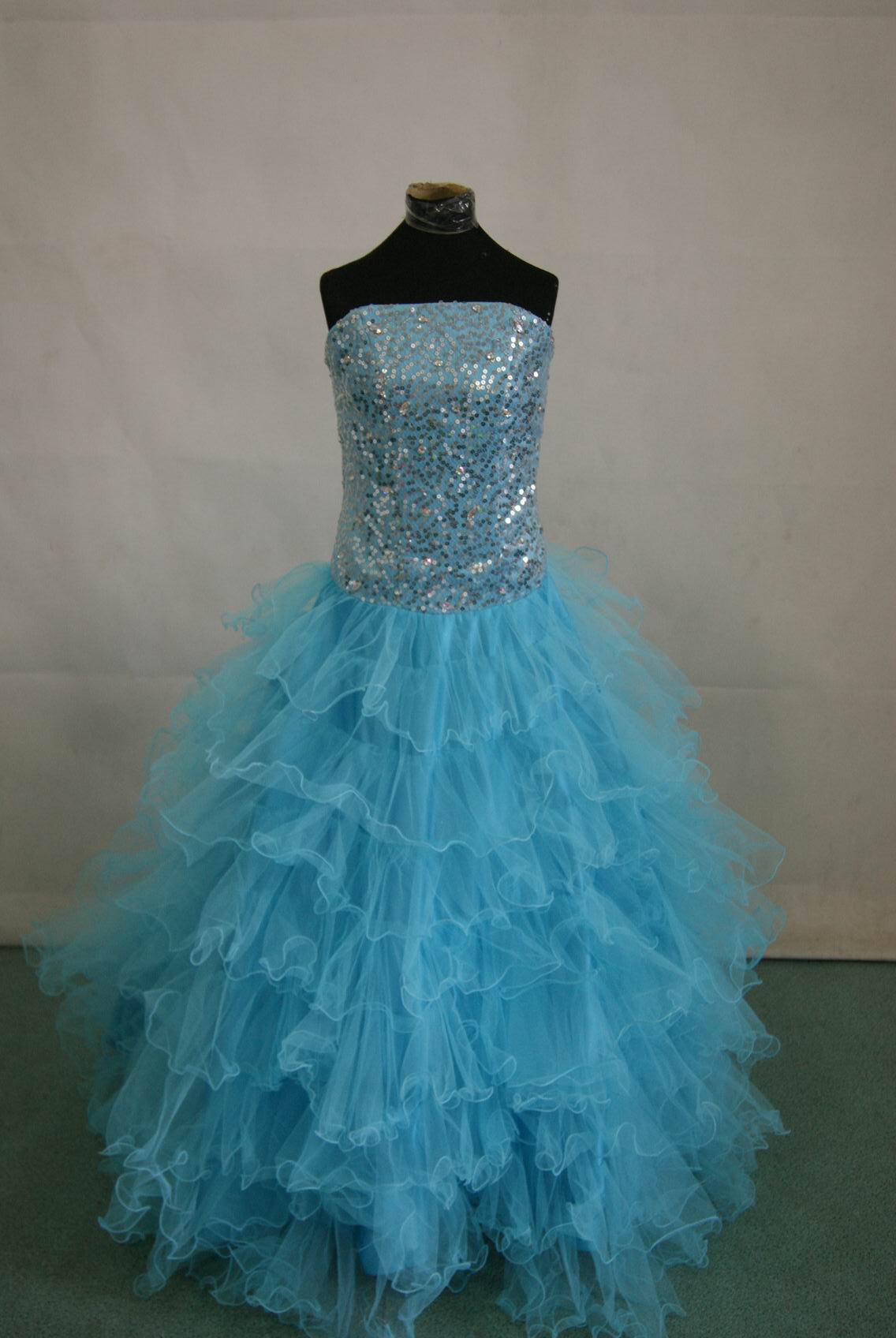 long strapless pool blue layered prom gown