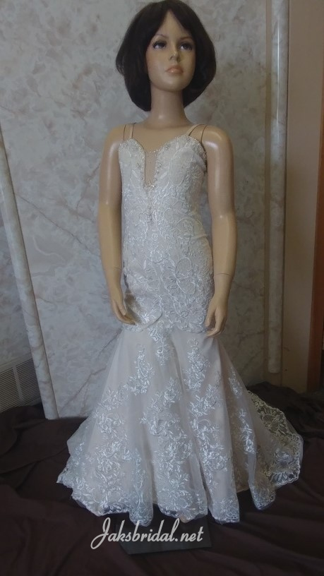  Modified A-line flower girl gown.  Spaghetti strap dress with a stunning modified reveal neckline.