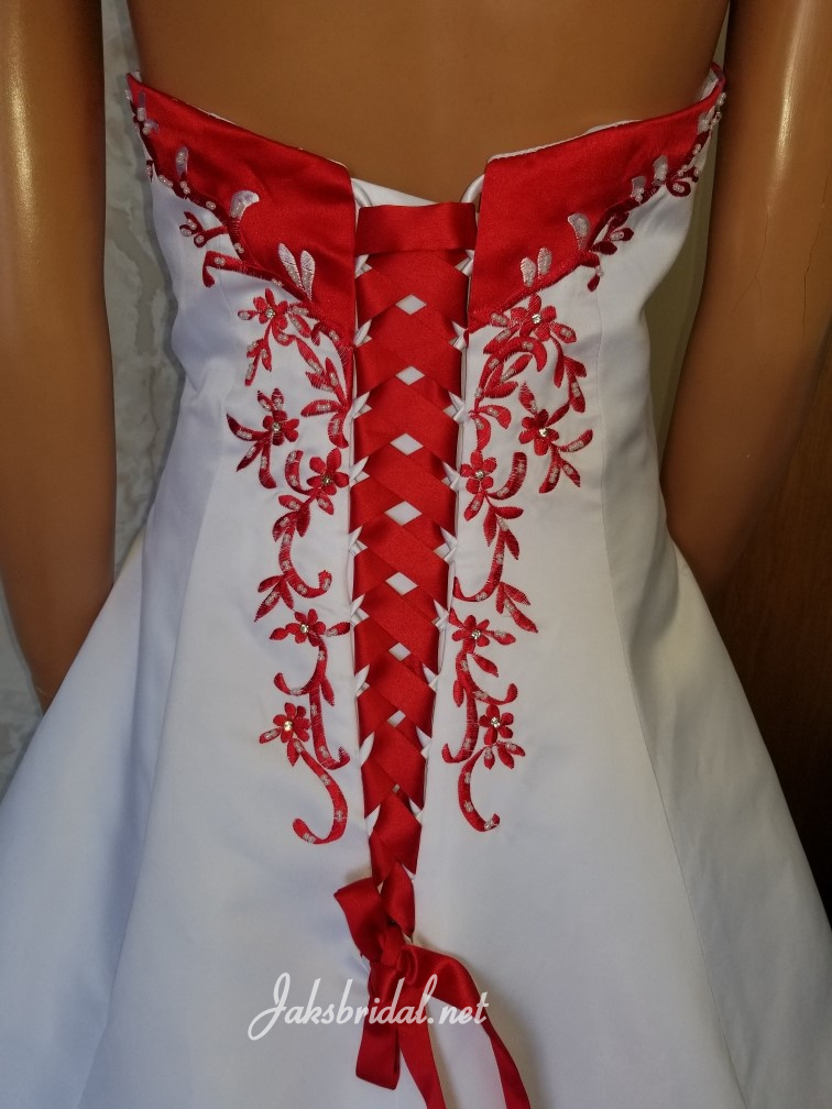white wedding gown with red trim