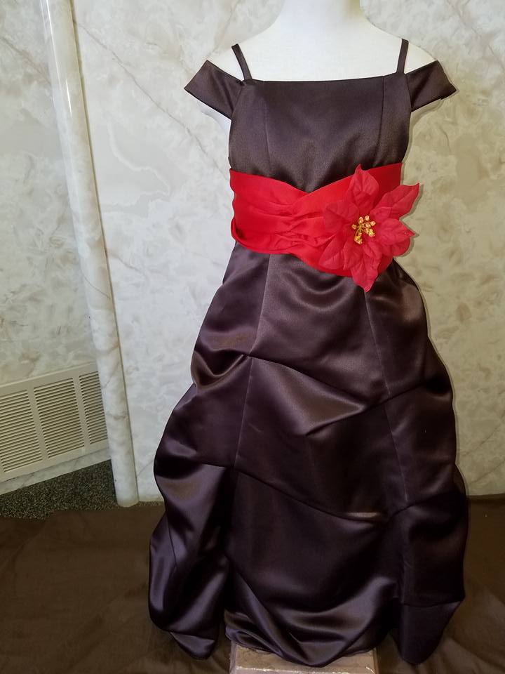 chocolate brown holiday dress with red poinsettia sash