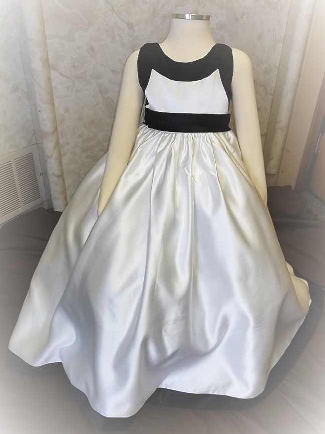 Light ivory and black dress shown in a size 3
