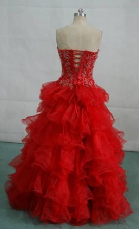 Red strapless see through bodice ball gown