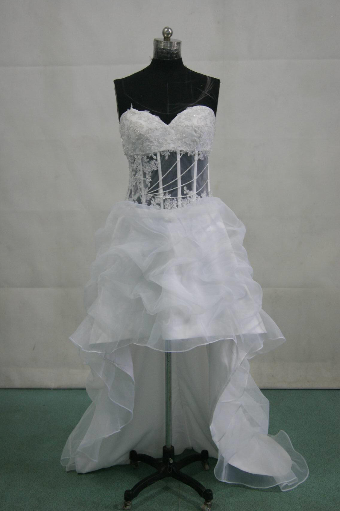white dress with see through bodice, corset tie back and a small train