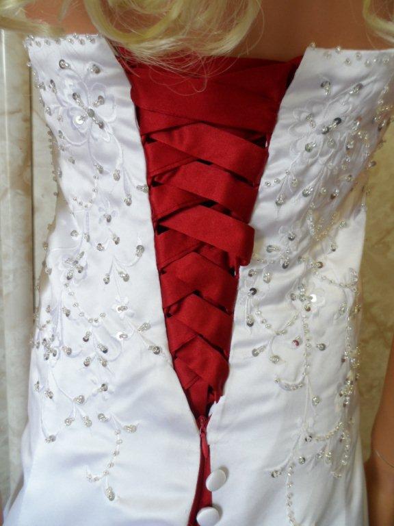 white wedding gown with red corset lace ups