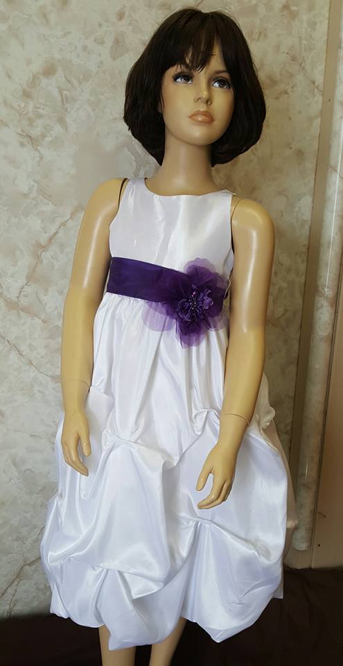 white dress with purple sash