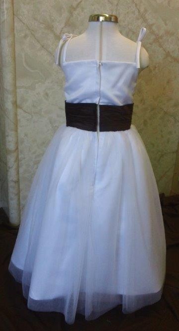 white dress with chocolate sash