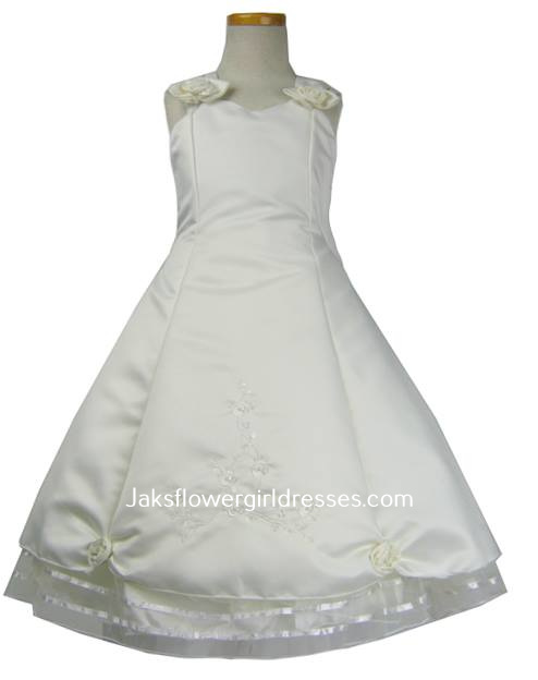 Long white cap sleeve flower girl dress featuring a rose on each shoulder, embroidered skirt. Clearance priced @ $40. 