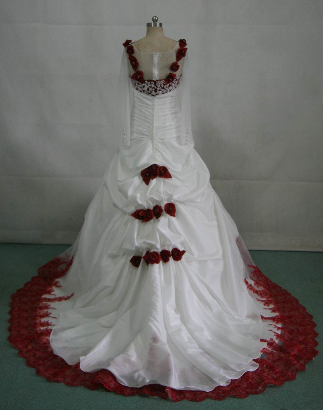 white wedding gown with red roses on the dress
