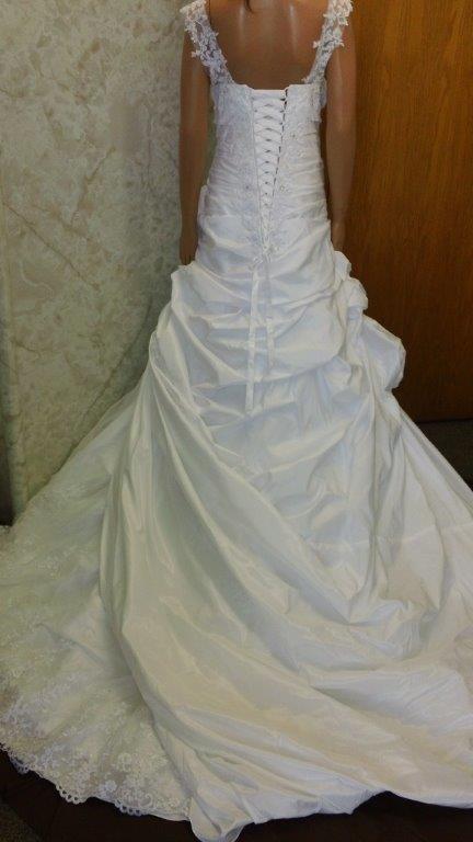 cascading bustles on white wedding dress