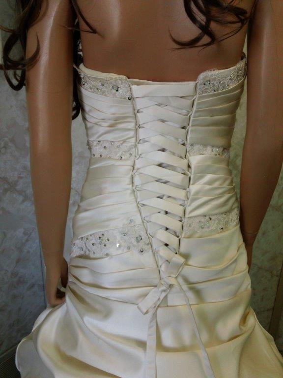 Pleated drop waist wedding gown with corset back