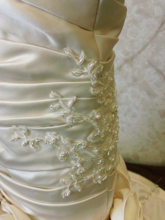 pleated bodice with side embellishment