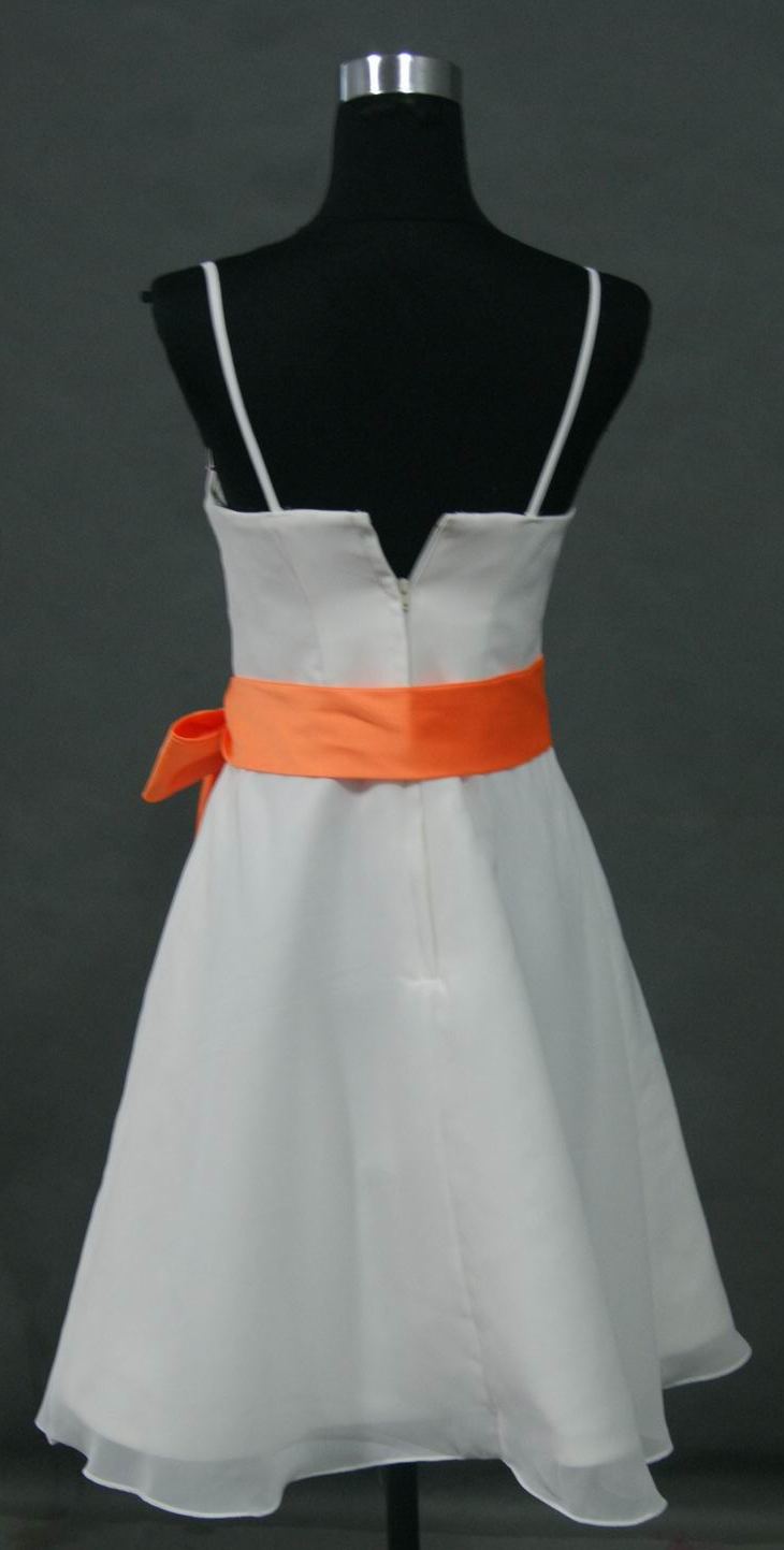 white dress with tangerine sash