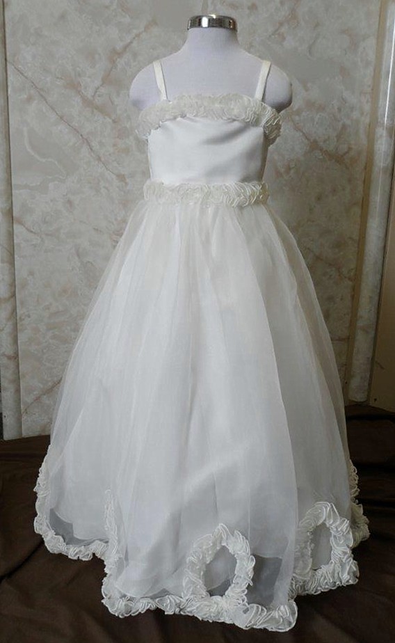 Girls white miniature flower girl dresses with spaghetti straps, matching flounce on waist, dress top and hemline.
