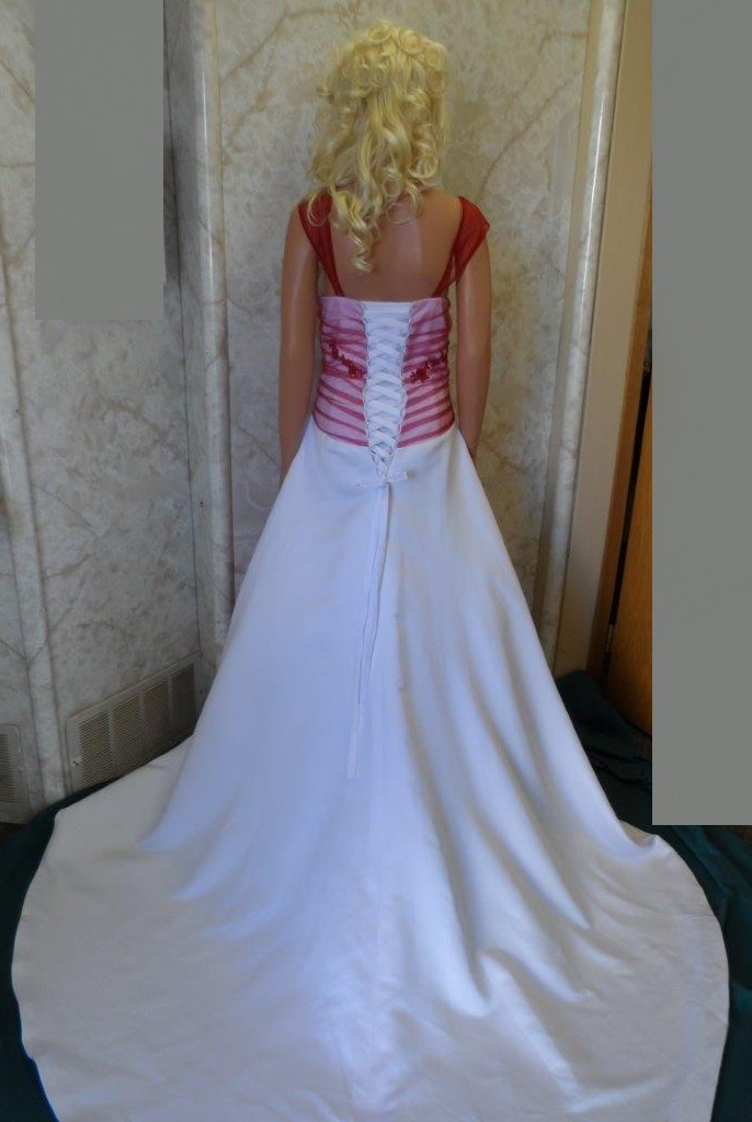 White wedding gown with apple red overlay