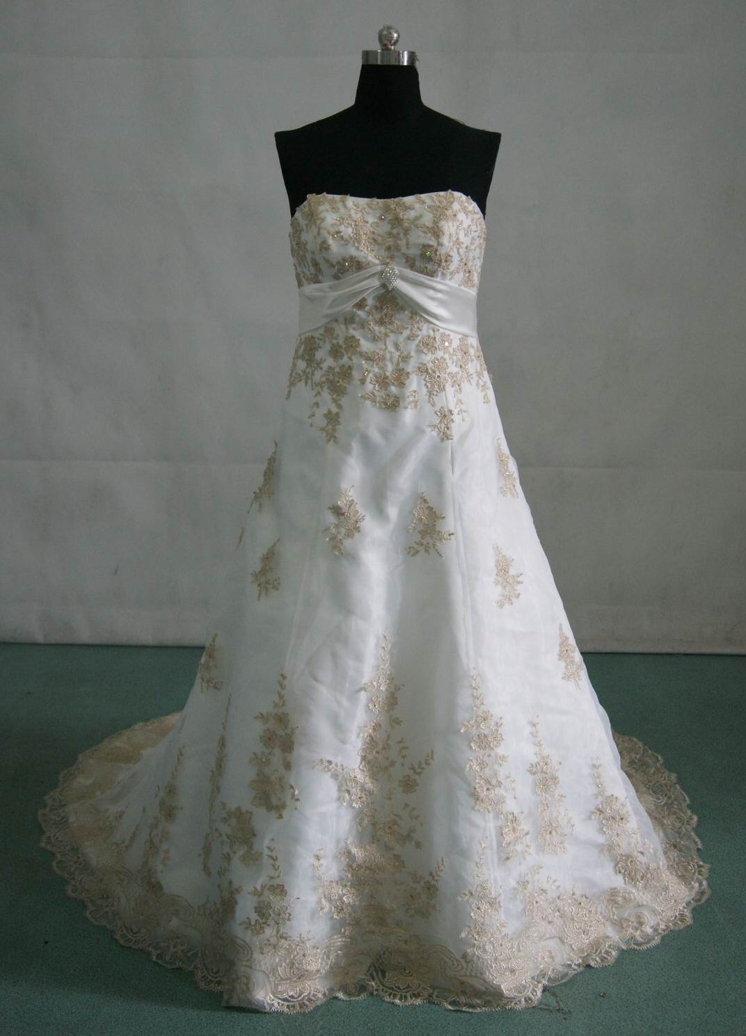 ivory wedding gown with gold appliques