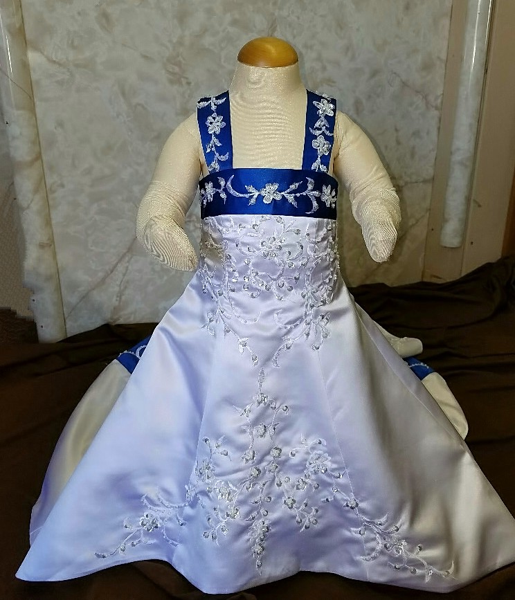 infant wedding dress in white and royal blue