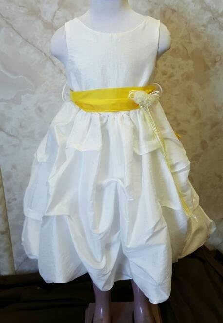 girls ivory pick up dress with yellow sash $40