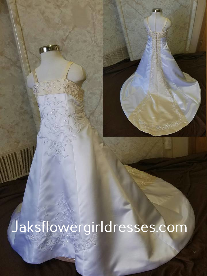White A-line embroidered miniature wedding gown with yellow accents.  Size 4 in stock and on sale for $100.