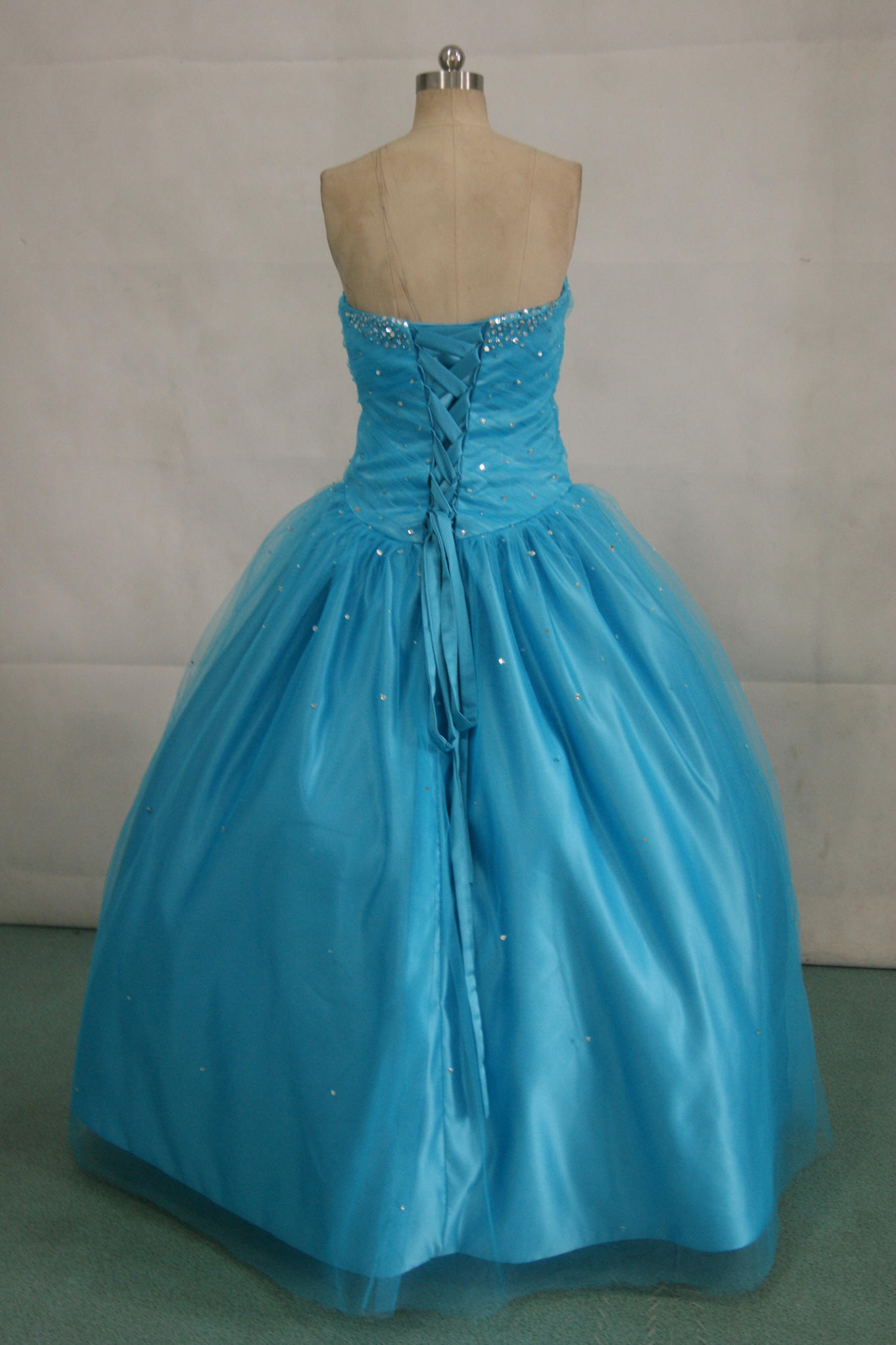 Peacock blue prom dress with silver beading
