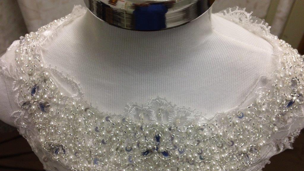 silver and pearl beading for neckline, and under chest