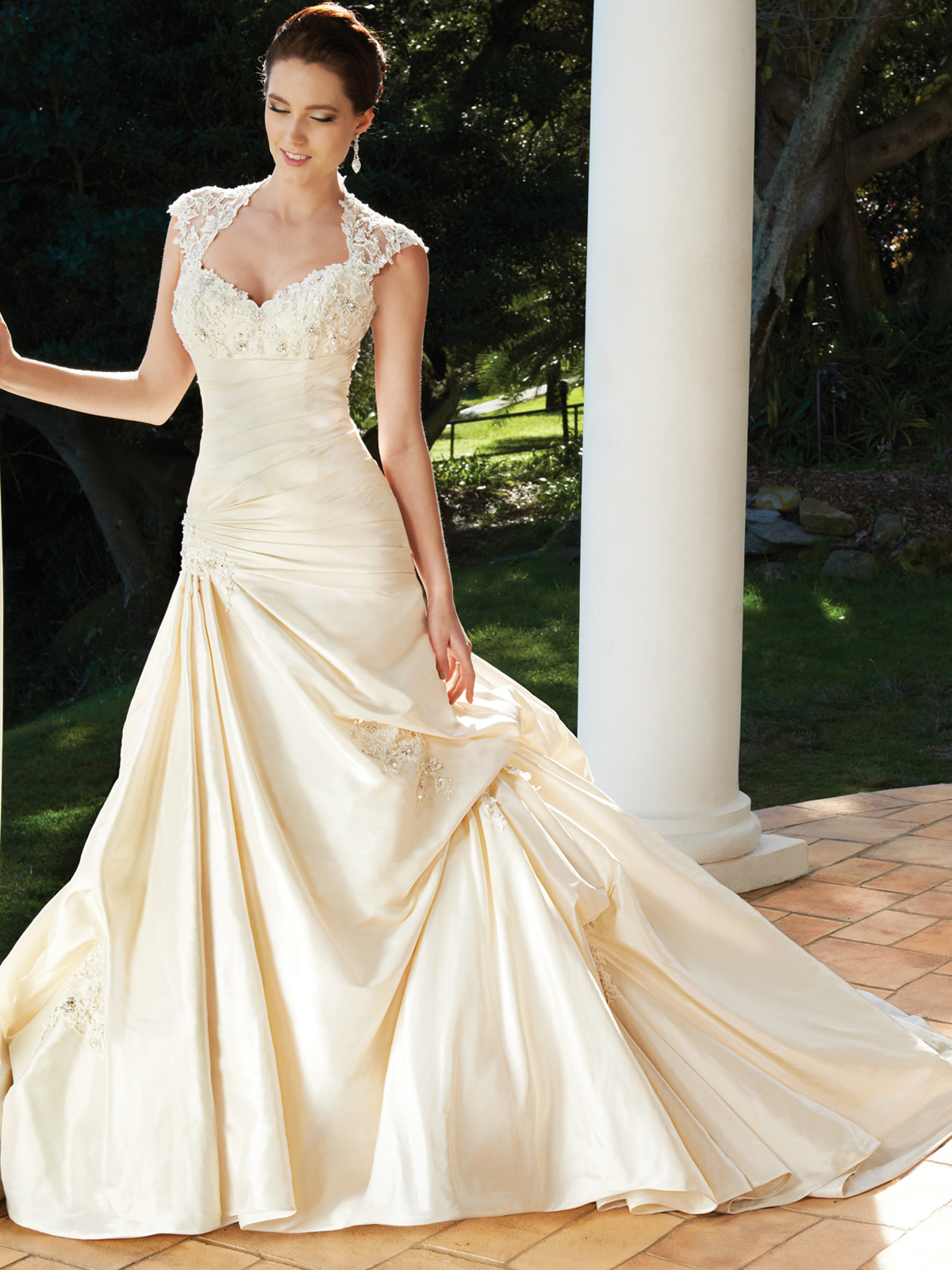 Lace cap sleeve wedding gown.