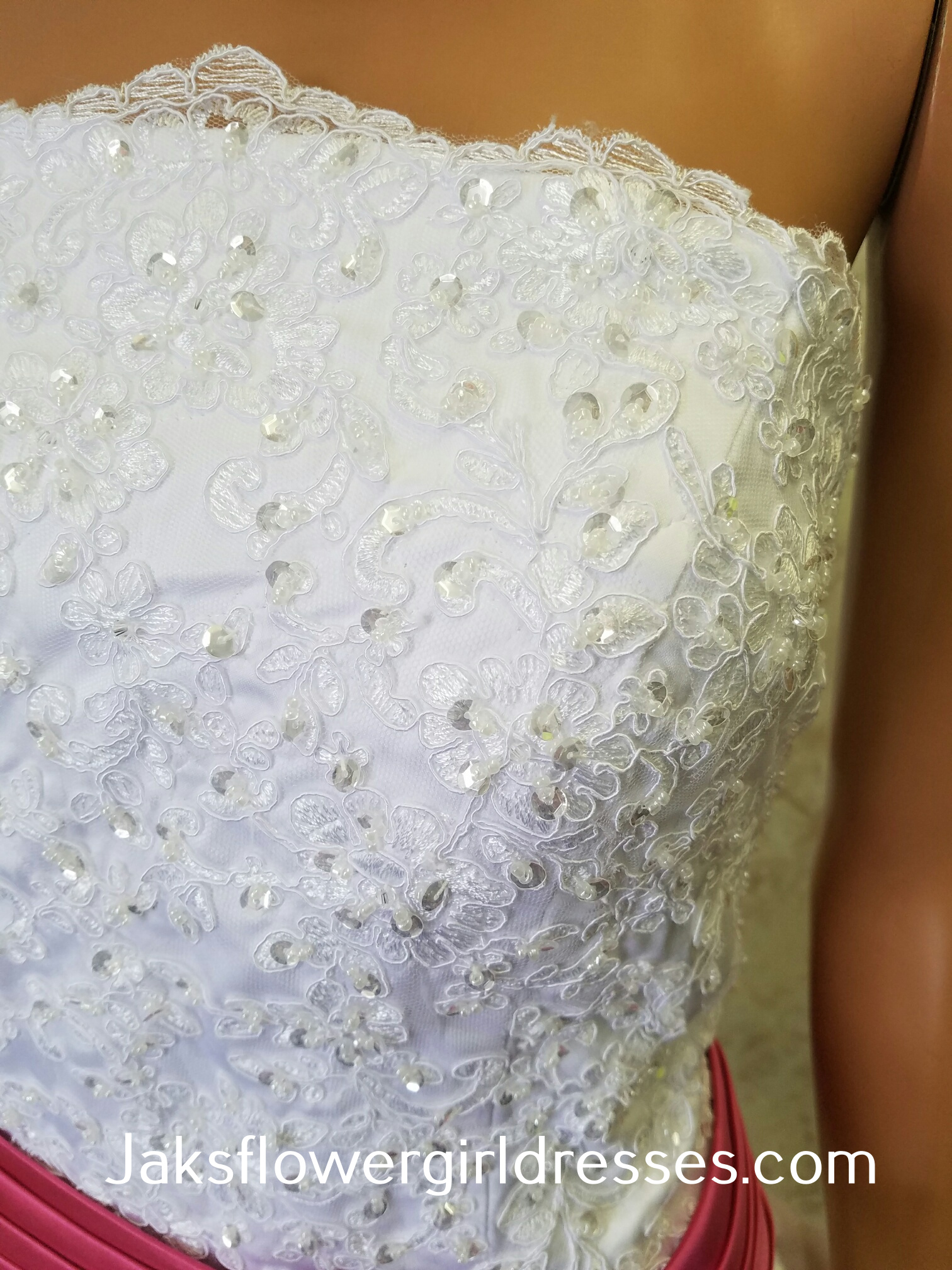 white wedding dress with watermelon sash