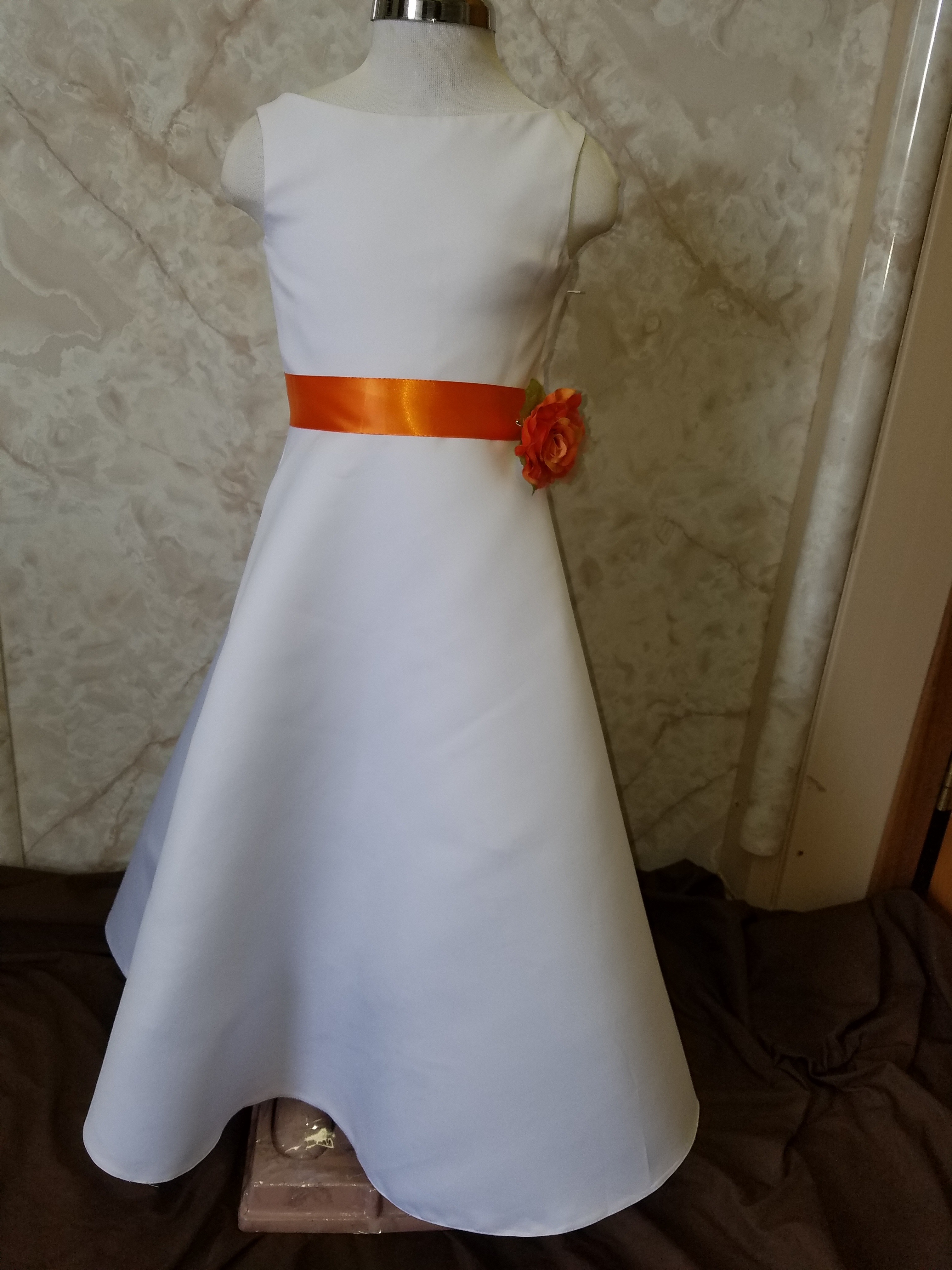 long white flower girl dress with orange sash