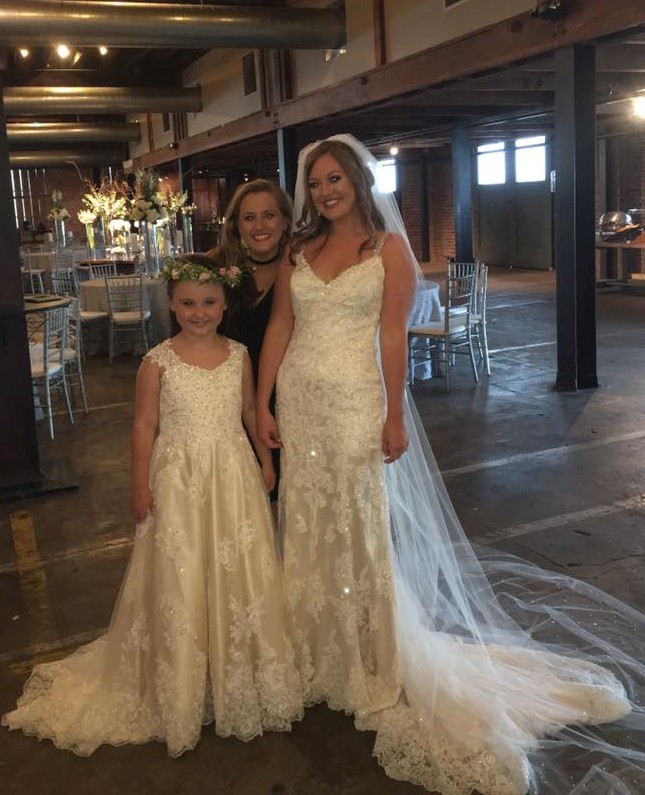 happy bride with matching flower girl dress