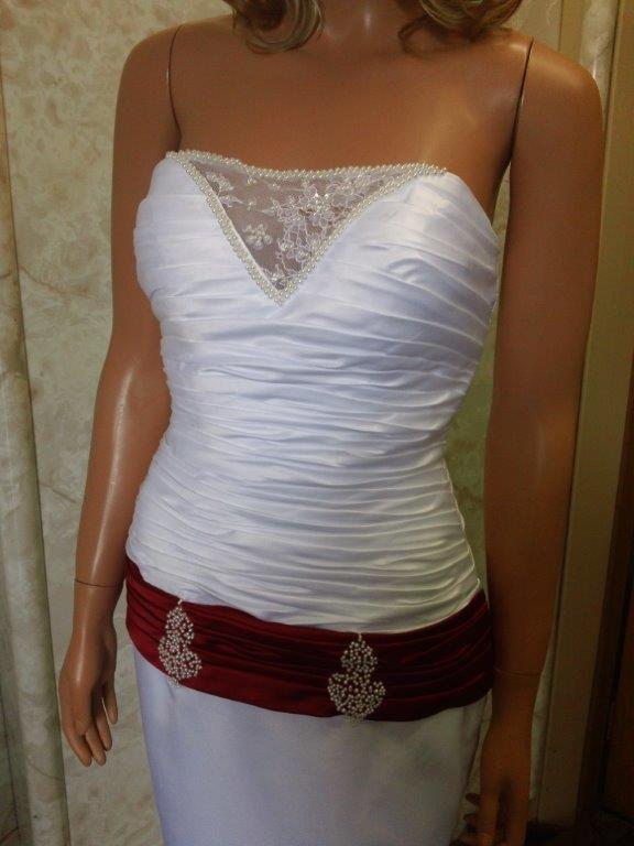 white wedding gown with red dropped sash