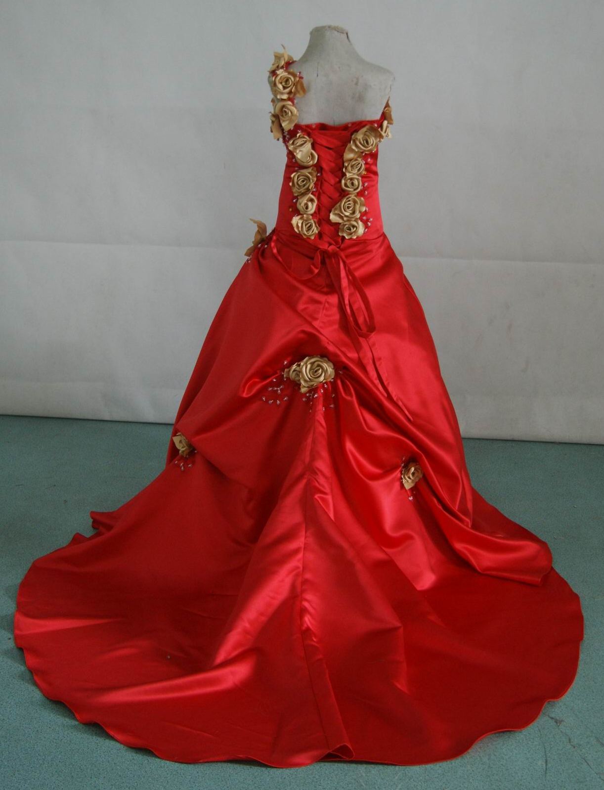 red ballgown with gold rose strap