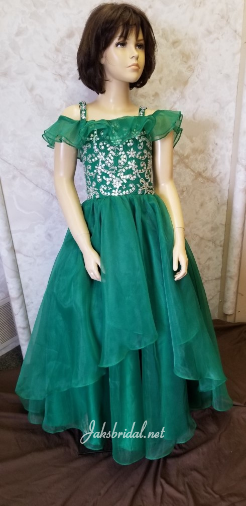 Lovely green chiffon pageant dress with ruffled cold shoulders, beaded bodice and flowing layered floor length skirt.