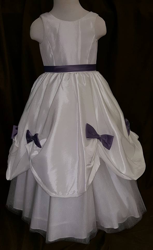 white dress with removable purple bows and sash