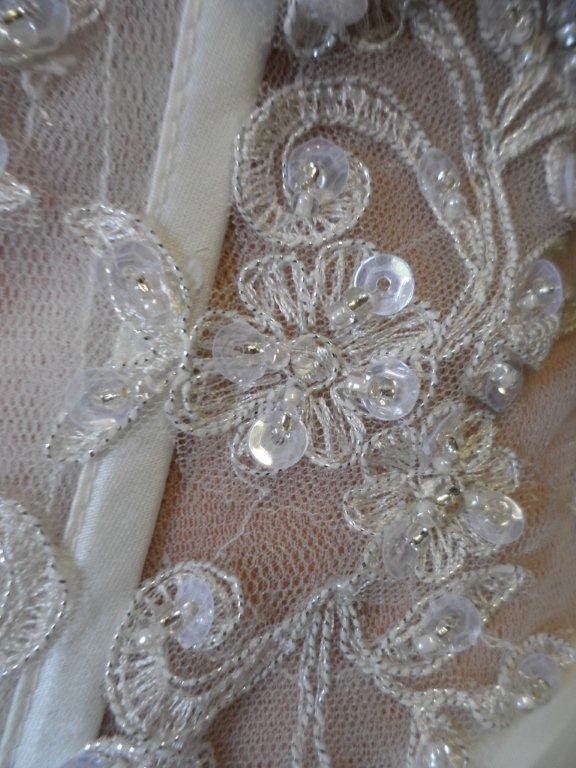 Jeweled one shoulder wedding gown.