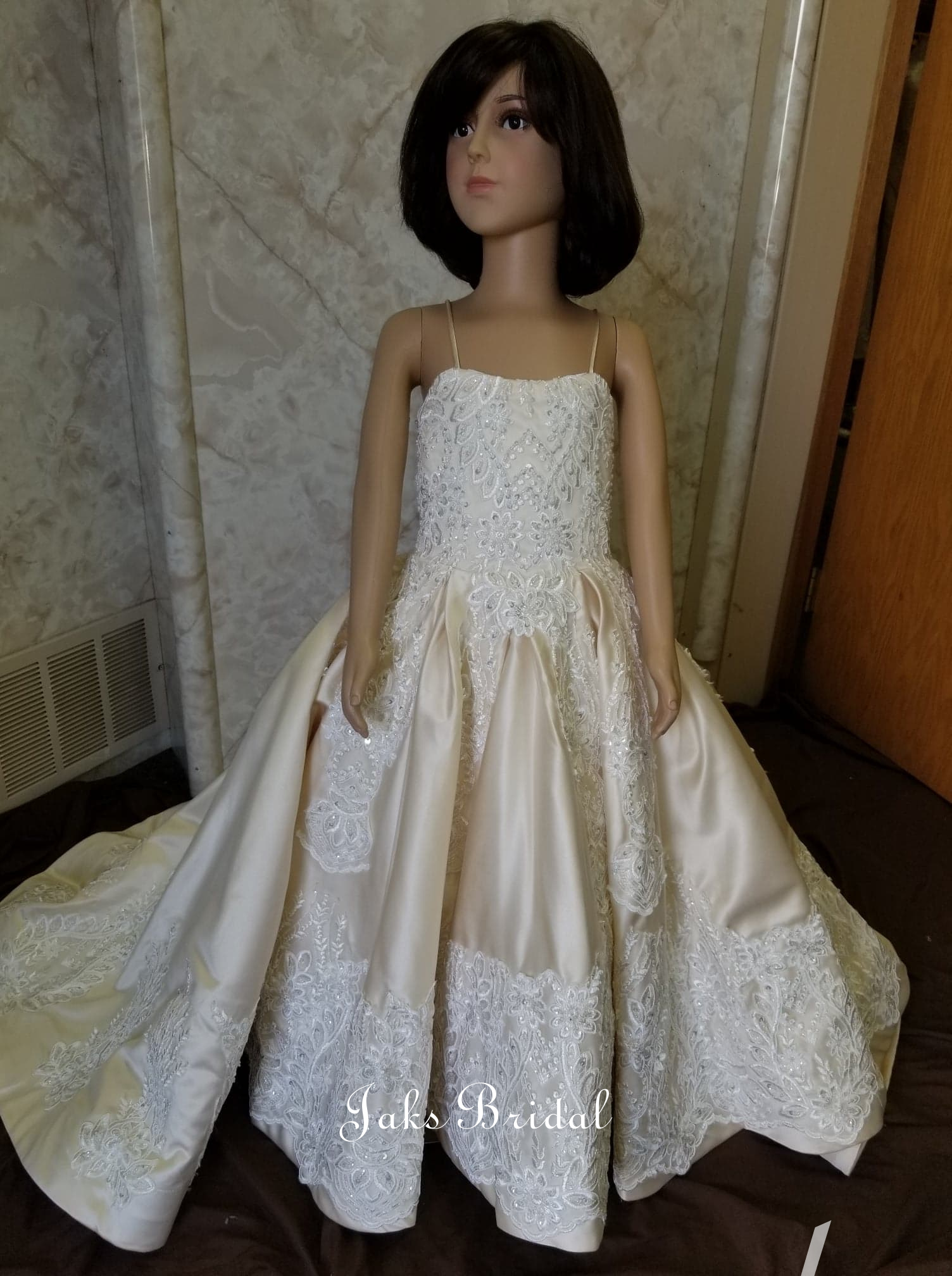 Jak's custom creates your flower girl dress to match your own wedding gown.