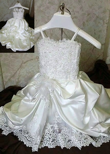 Beaded lace baby wedding dress with cascading train. Infant replica match of brides wedding gown.