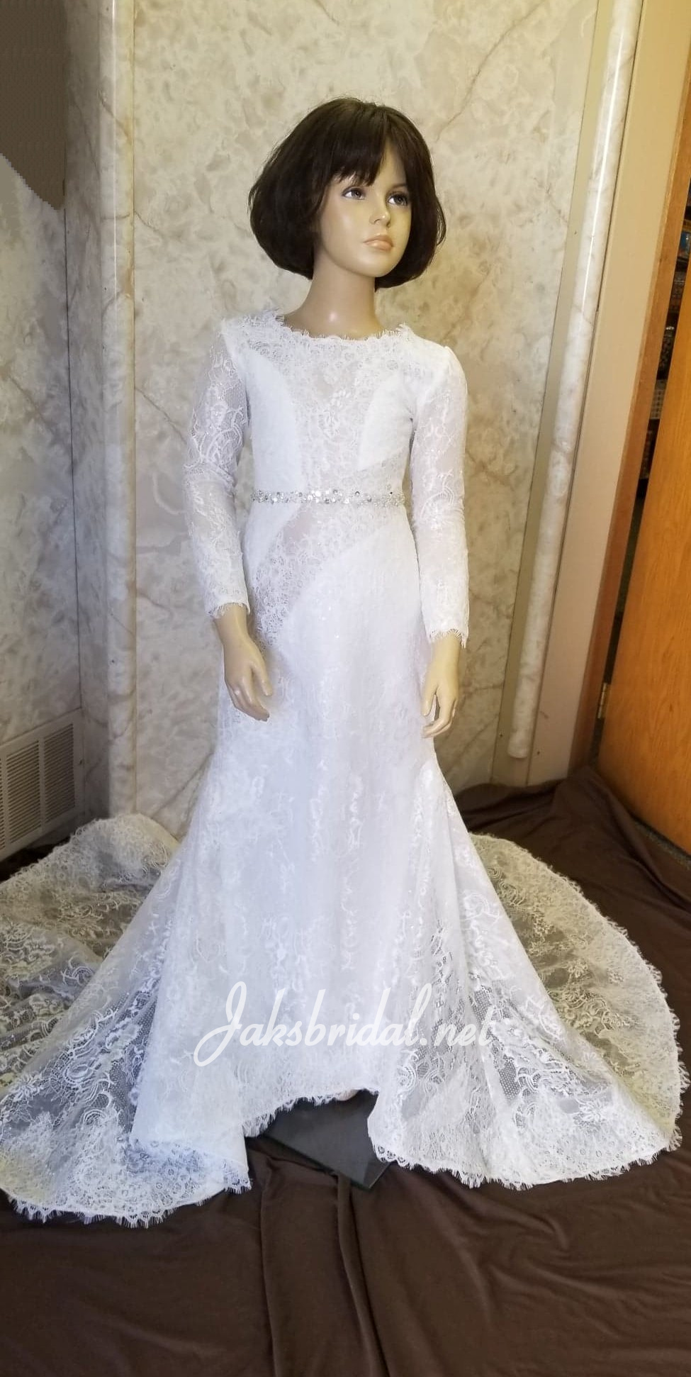 Long sleeve flower girl dress in beautiful lace, sprinkled with sequins. 