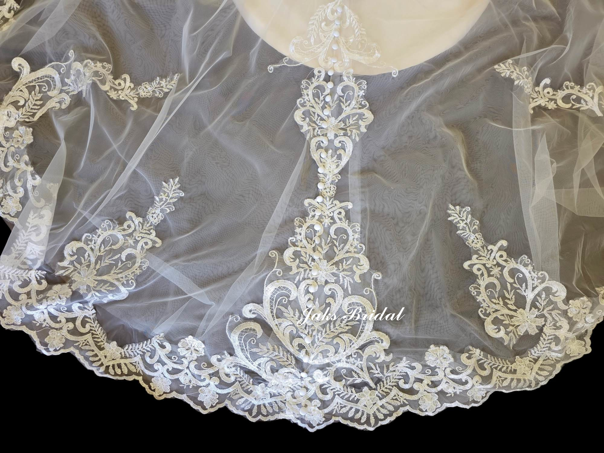 lace appliques placed over tulle train