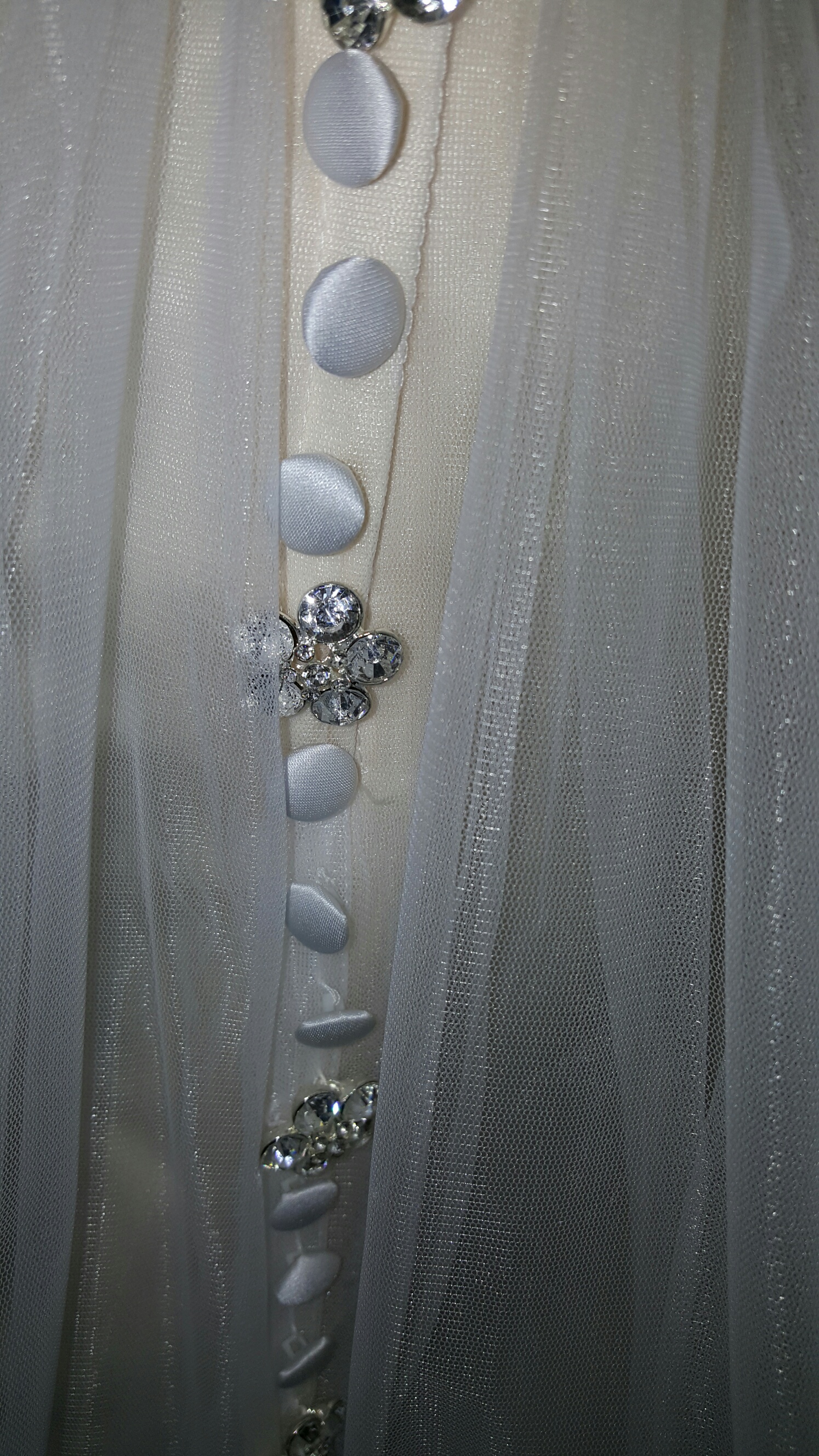 covered and beaded buttons over zipper