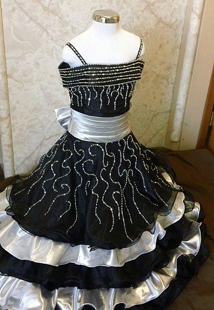 black pageant dress with gold accent