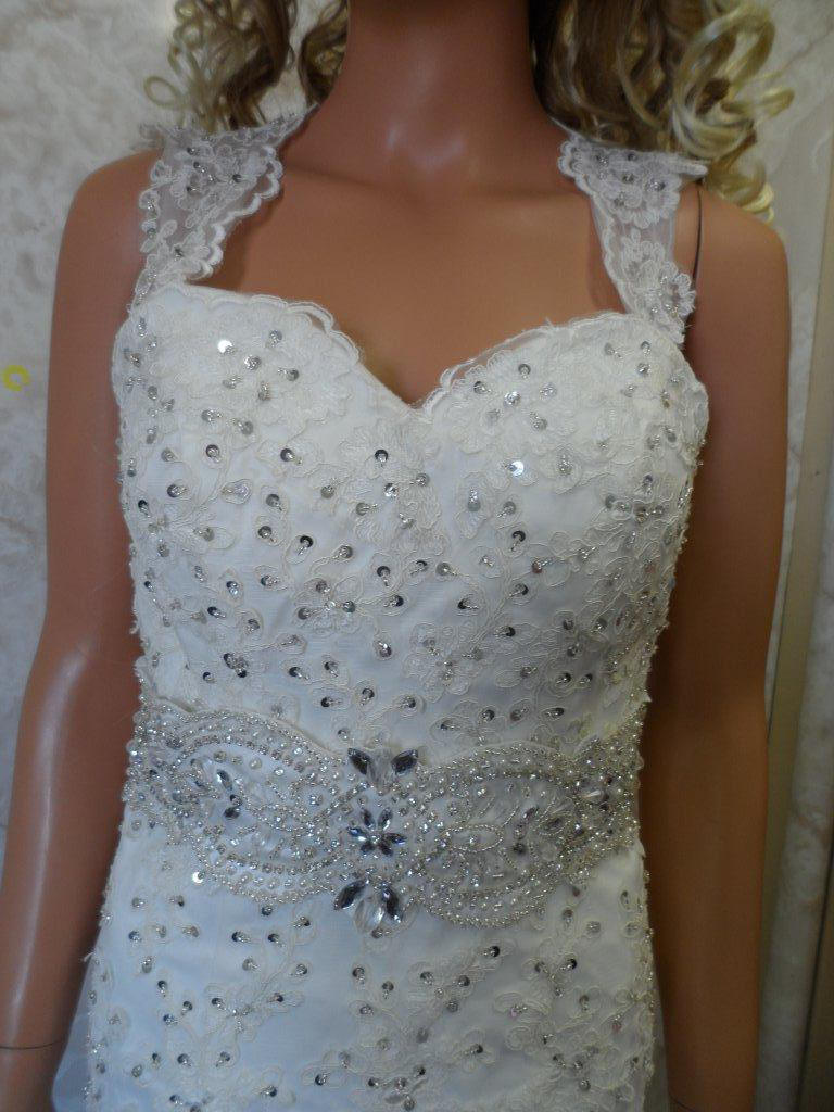 Lace wedding gown with lavish sash