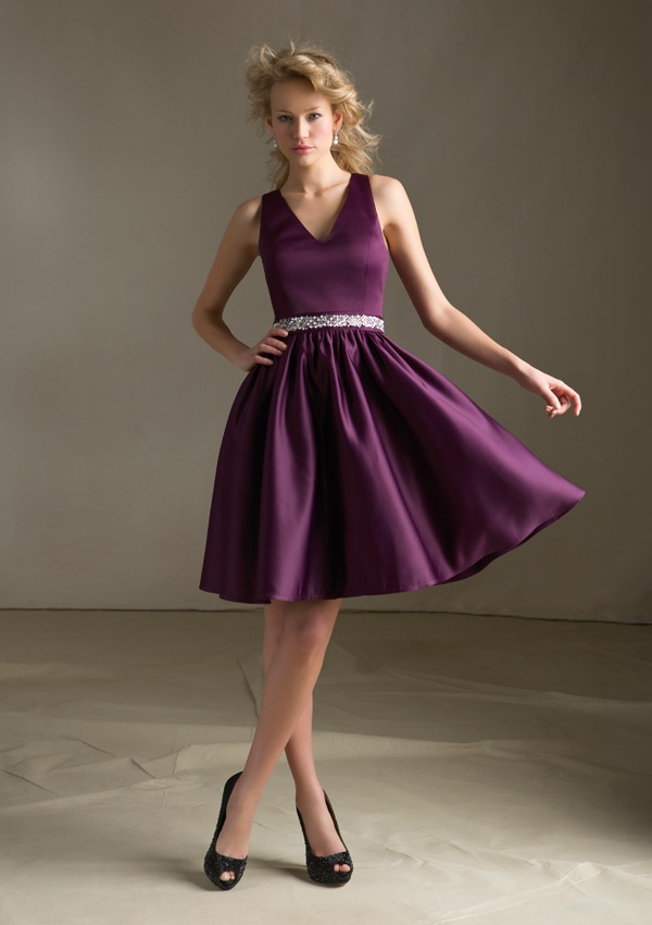 Short purple bridesmaid dress with sash.