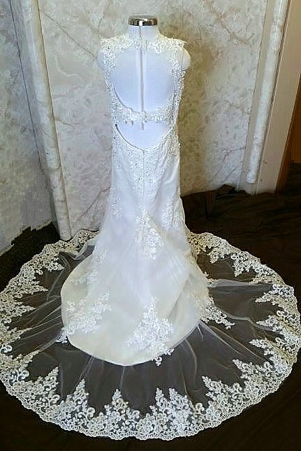 dress with cut out back and lace edged train