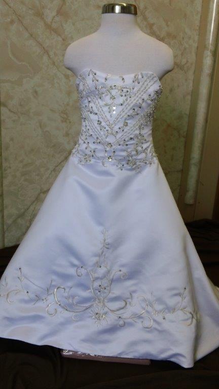 Strapless flower girl dress with embroidered long train