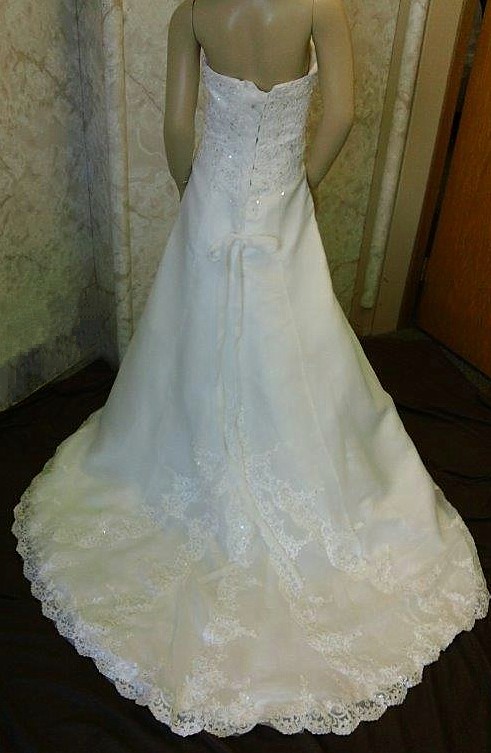 Beaded lace side drape with satin split front gown