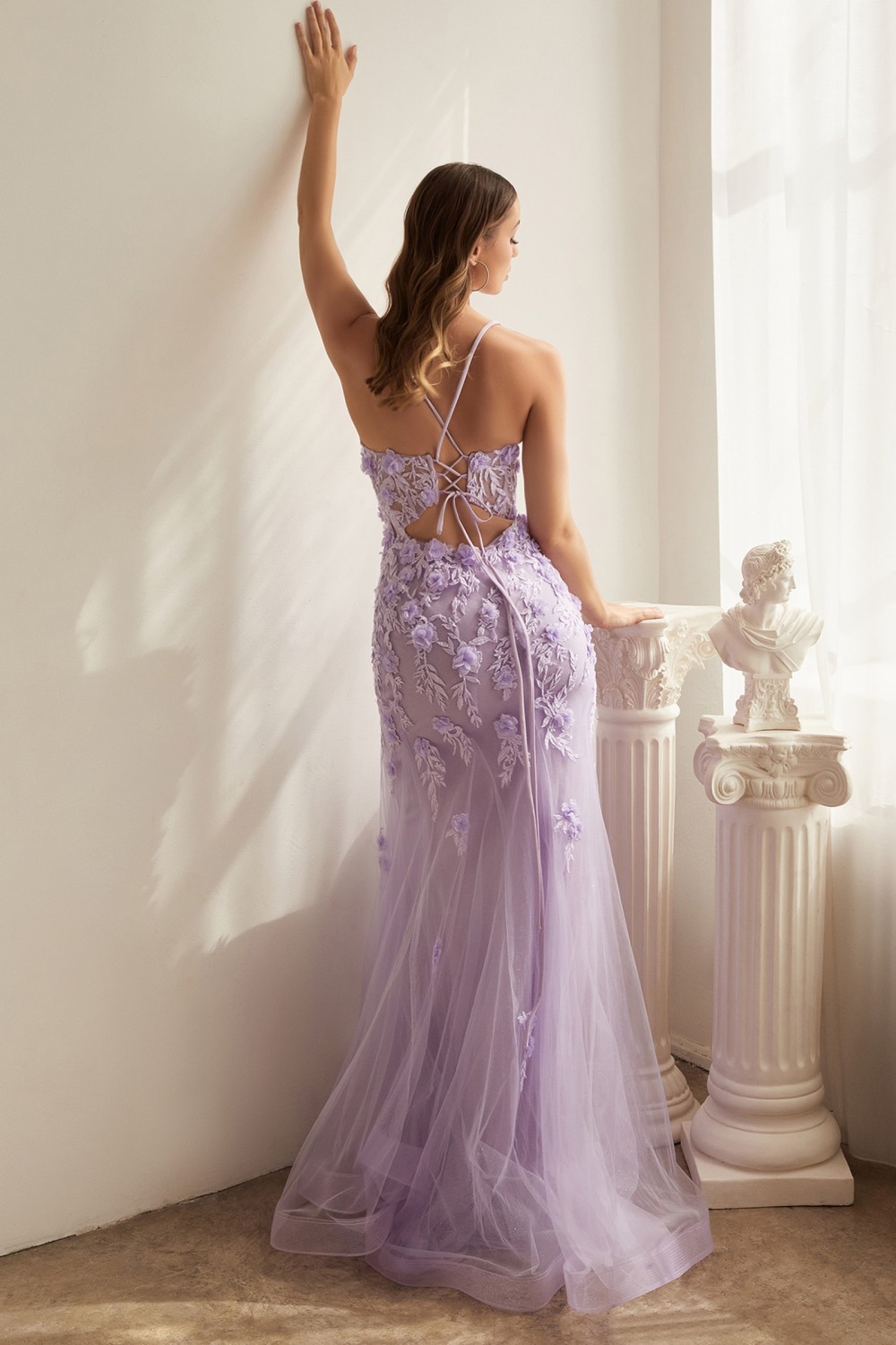 lavender form-fitting gown with a sheer boned bodice, floral applique, a lace up keyhole back for an added hint of sexy sass. 