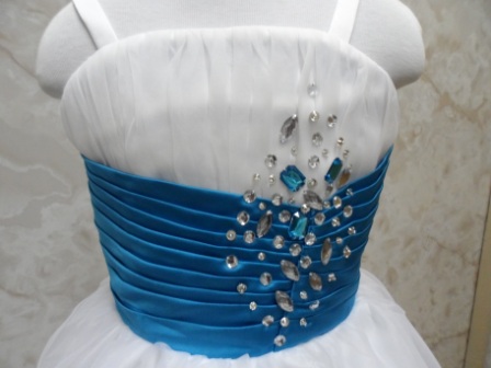 dress is dazzled with blue and silver jewels